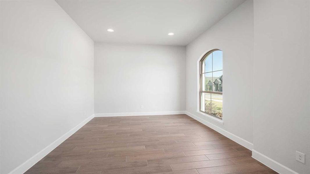 Spare room featuring light wood-type flooring