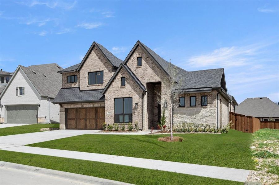 Front exterior of a new home in Redden Farms - Phase 1, Midlothian, TX, highlighting curb appeal (Image 2). Front exterior of a new home in Redden Farms - Phase 1, Midlothian, TX, highlighting curb appeal (Image 2).