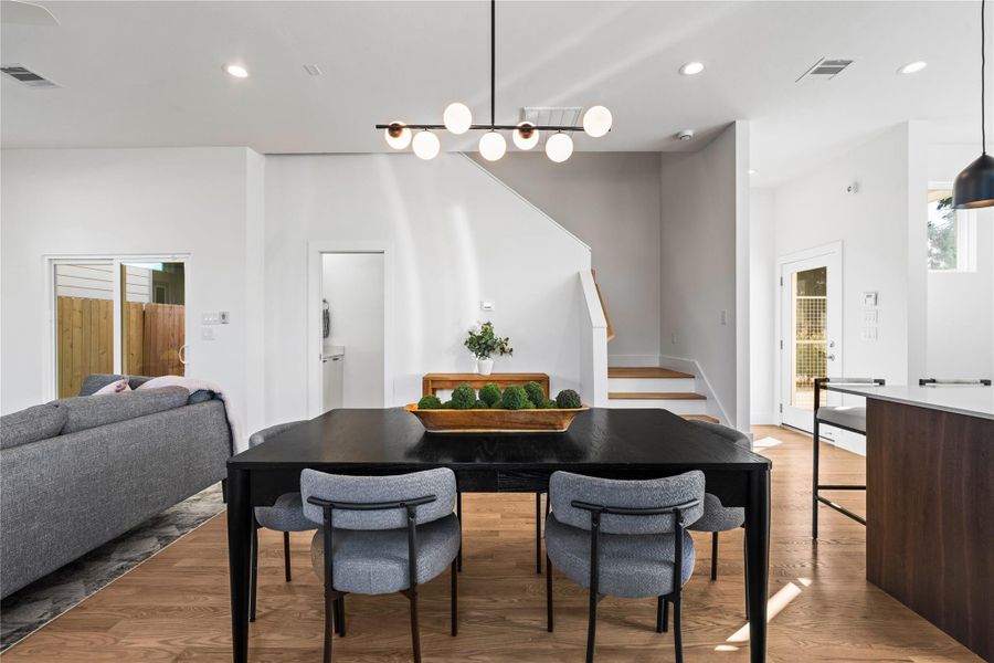 Warm & inviting dining space framed by designer lighting, clean architectural lines & easy access to the home’s main living areas. Warm & inviting dining space framed by designer lighting, clean architectural lines & easy access to the home’s main living areas.