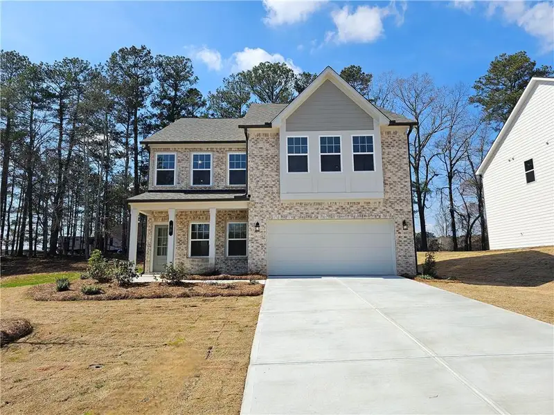 Front exterior of a new home in The Estates at Casteel, Bethlehem, GA, highlighting curb appeal (Image 20).