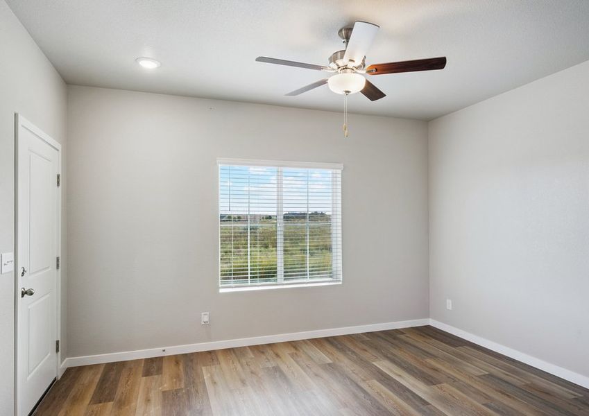 The family room is spacious with a ceiling fan.