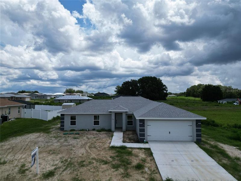 Front exterior of a new home in , Inverness, FL, highlighting curb appeal (Image 26). Front exterior of a new home in , Inverness, FL, highlighting curb appeal (Image 26).