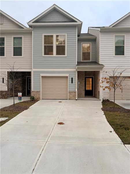 Front exterior of a new home in , South Fulton, GA, highlighting curb appeal (Image 1). Front exterior of a new home in , South Fulton, GA, highlighting curb appeal (Image 1).