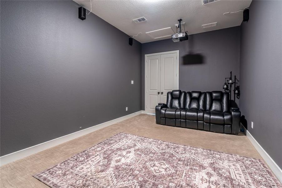 Bedroom with light carpet and baseboards