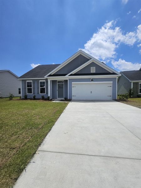 Front exterior of a new home in Edgefield, Loris, SC, highlighting curb appeal (Image 2). Front exterior of a new home in Edgefield, Loris, SC, highlighting curb appeal (Image 2).