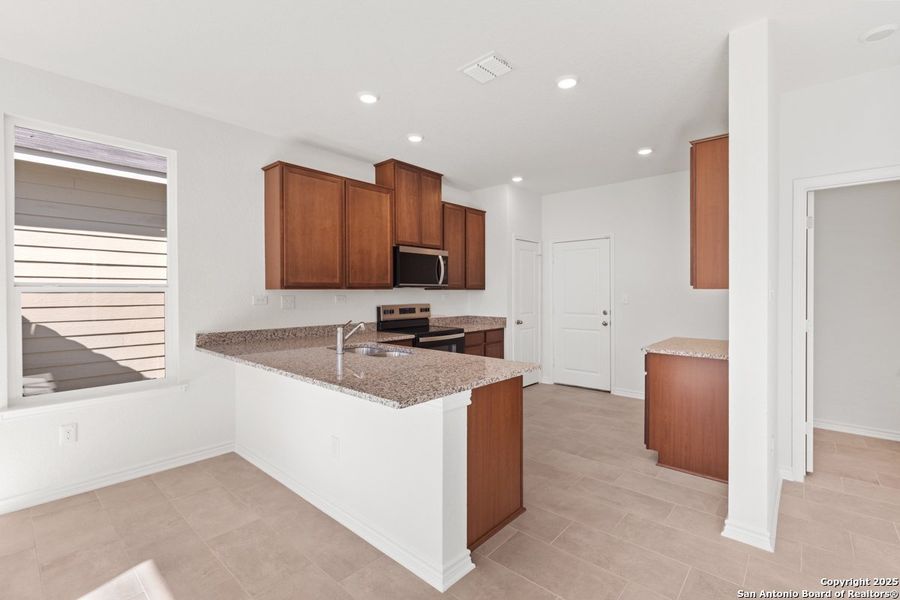 Furnished interior view inside a new home in Spanish Trails Villas, San Antonio (Image 6).