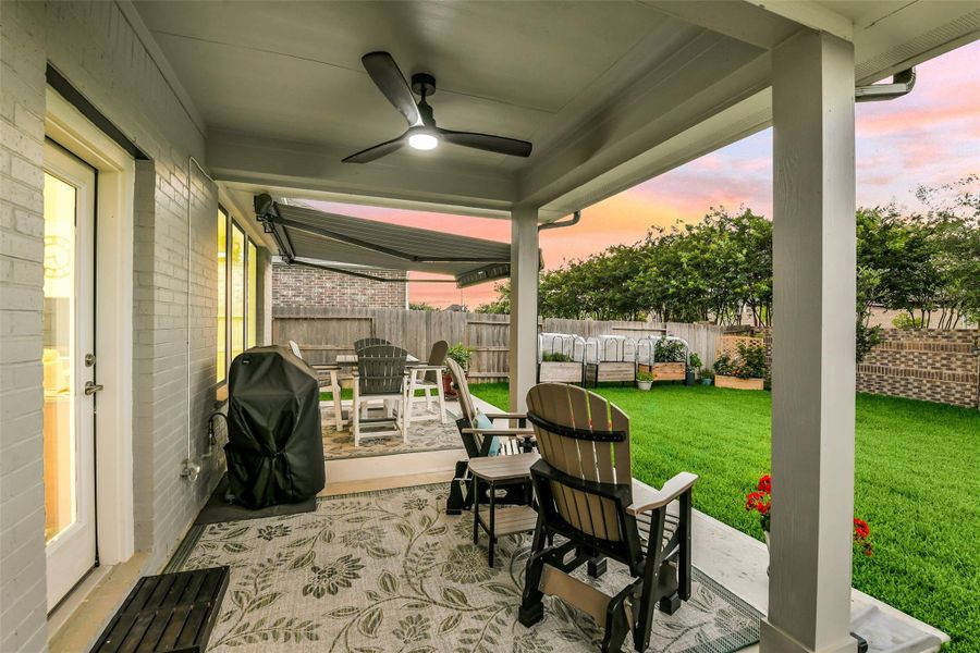 The retractable awning doubles the covered outdoor space in this home!