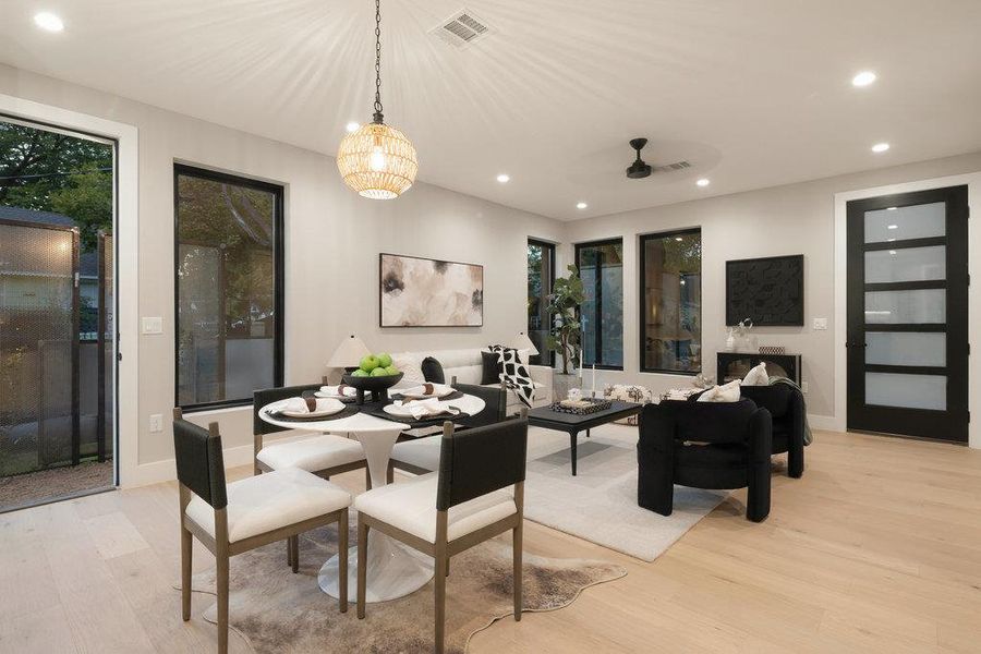 Dining area with recessed lighting, light wood finished floors, and a ceiling fan