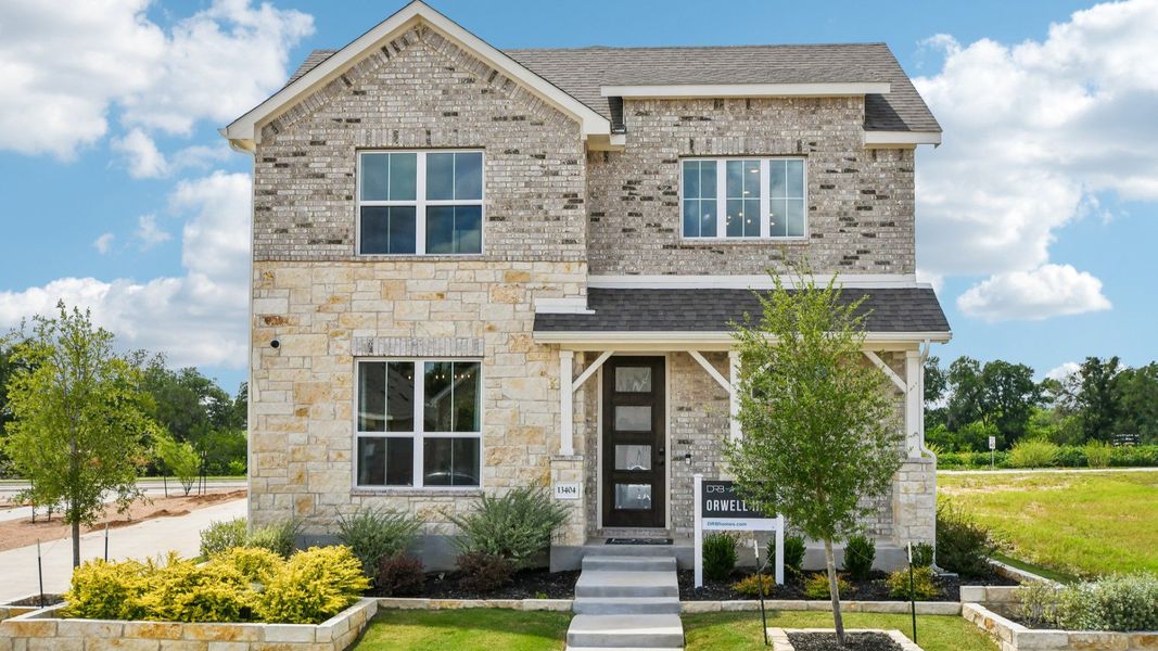 Representative exterior photo of a completed home built from the Orwell III by DRB Homes in Creeks Crossing, Elgin, TX (Image 24).