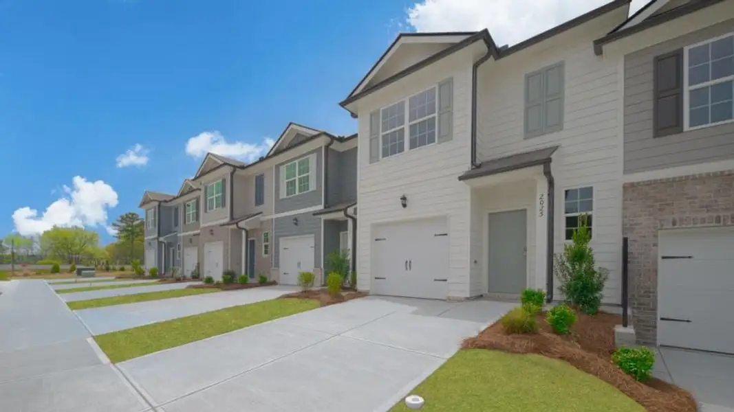 Front exterior of a new home in Roseleigh Park, Douglasville, GA, highlighting curb appeal (Image 2). Front exterior of a new home in Roseleigh Park, Douglasville, GA, highlighting curb appeal (Image 2).
