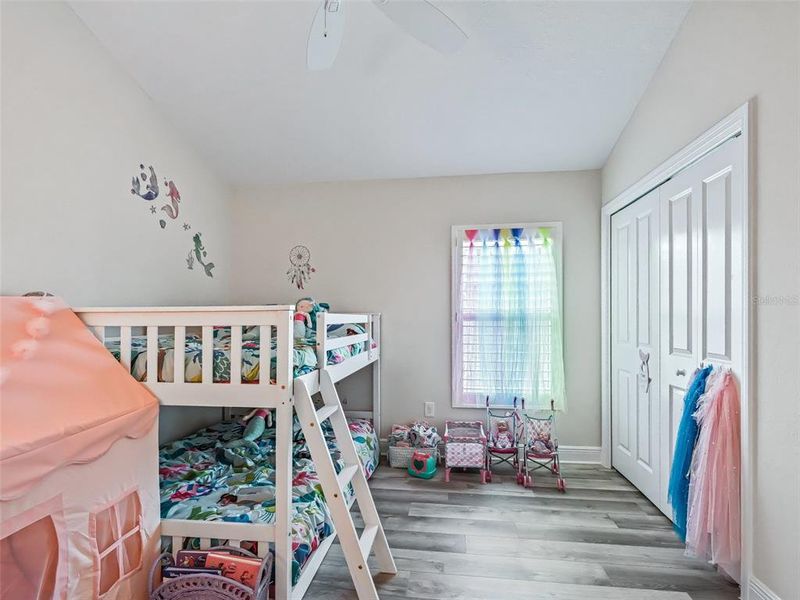 Third bedroom with vaulted ceiling and plantation shutters