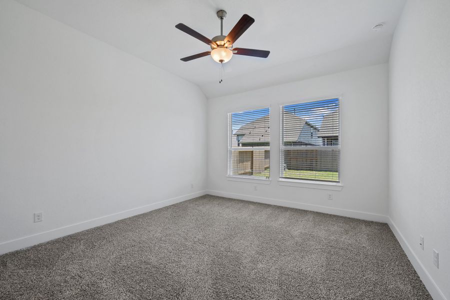 Representative unfurnished interior of a home built from the Sage by Chesmar Homes in Sunterra, Katy (Image 9).