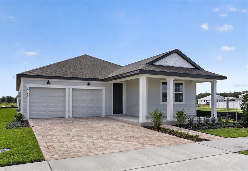 Front exterior of a new home in Trailside, Mount Dora, FL, highlighting curb appeal (Image 2). Front exterior of a new home in Trailside, Mount Dora, FL, highlighting curb appeal (Image 2).