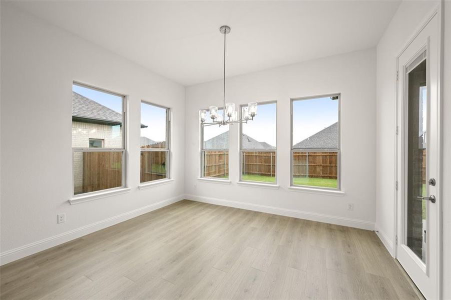 Unfurnished sunroom featuring a chandelier Unfurnished sunroom featuring a chandelier