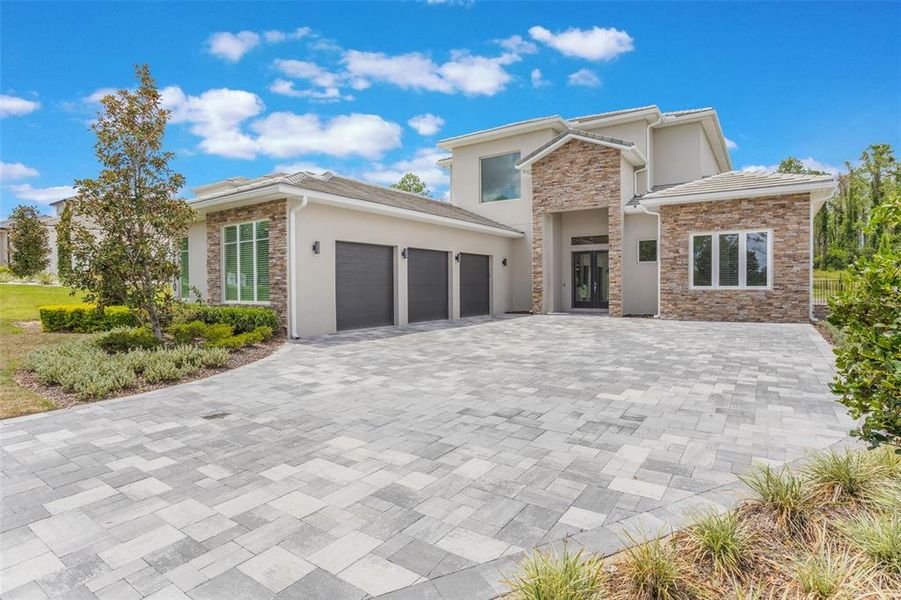 Front exterior of a new home in , Montverde, FL, highlighting curb appeal (Image 24).