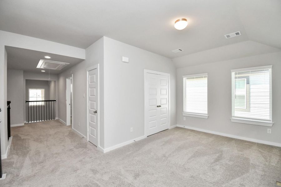 Ascend to relaxation in this fantastic game room! Ideal for both casual gatherings and adult gaming, it boasts plush carpet, lofty ceilings, custom paint, and ample windows for abundant natural light. Ascend to relaxation in this fantastic game room! Ideal for both casual gatherings and adult gaming, it boasts plush carpet, lofty ceilings, custom paint, and ample windows for abundant natural light.