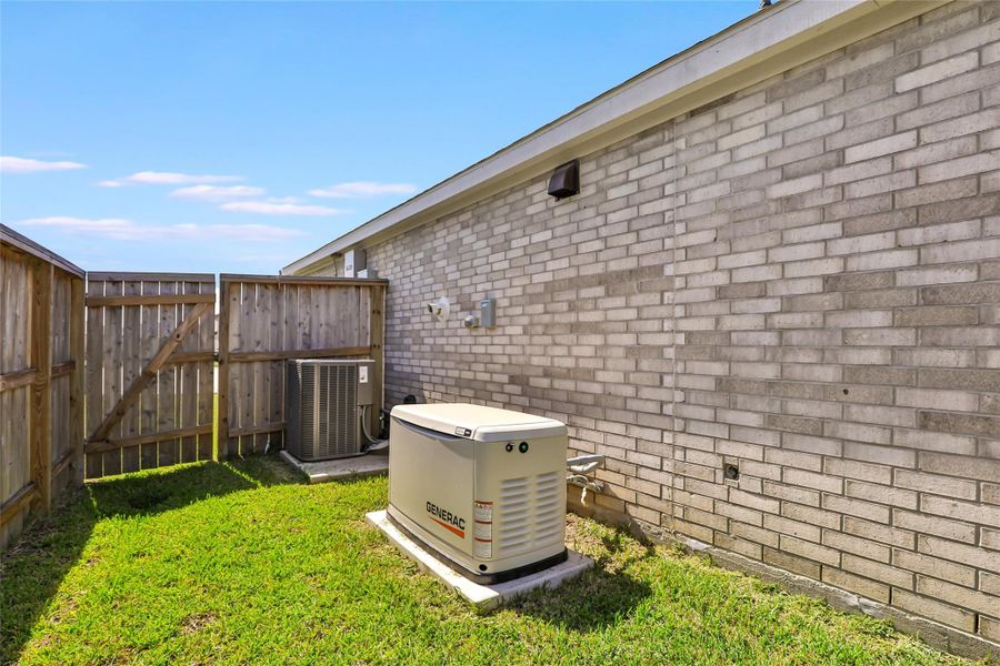 Exterior details and patio area of a home in Tavola, New Caney (Image 18).