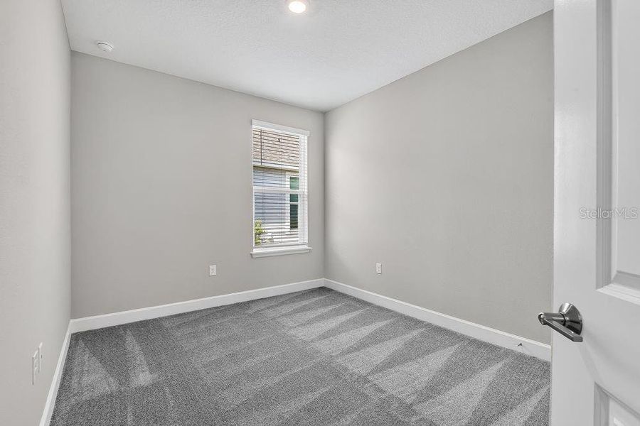 Spacious, unfurnished interior of a new home in Colbert Landings, Palm Coast (Image 32).