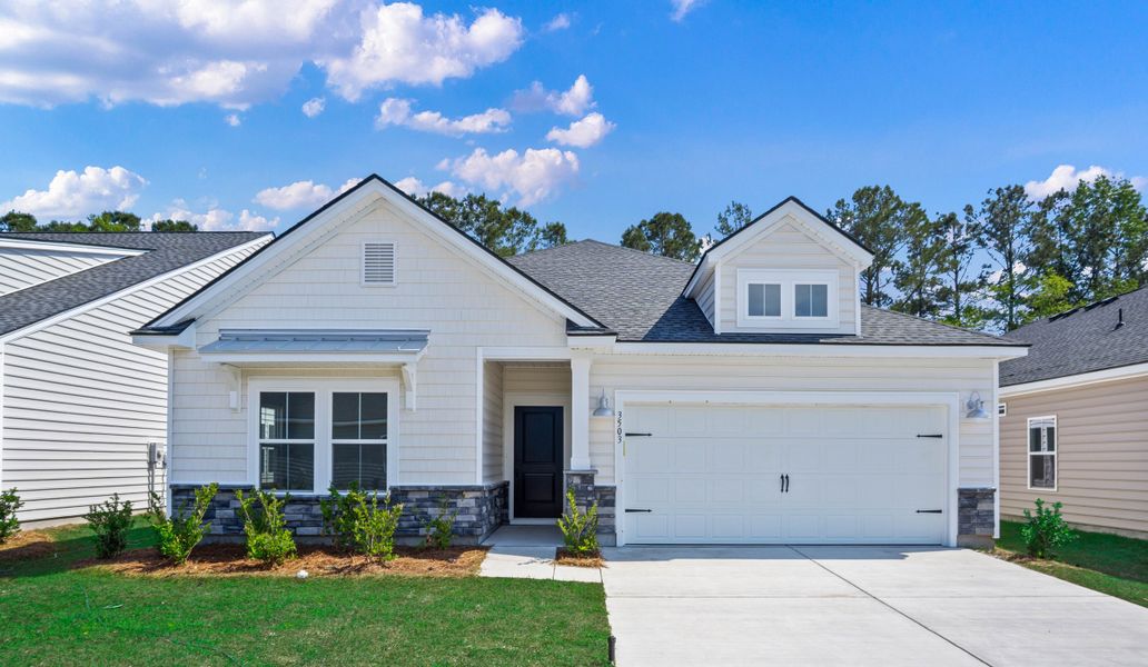 Front exterior of a new home in Wood Stork Landing, Ocean Isle Beach, NC, highlighting curb appeal (Image 1). Front exterior of a new home in Wood Stork Landing, Ocean Isle Beach, NC, highlighting curb appeal (Image 1).