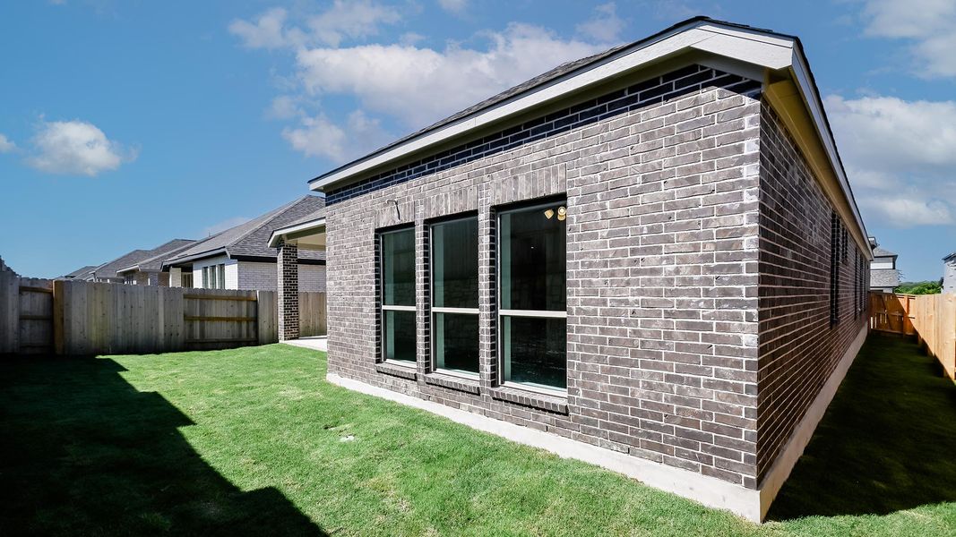 Exterior details and patio area of a home in Crosswinds, Kyle (Image 22).