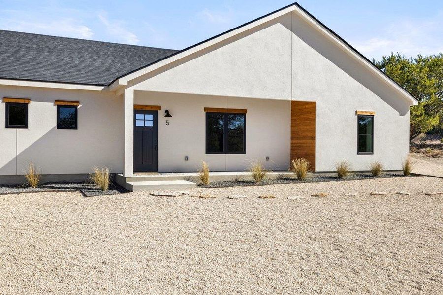 New Construction Hacienda WOW of a home. Single story, designer stunner on the best lot in Wimberley Springs!