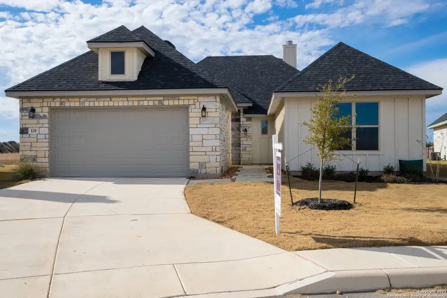 Front exterior of a new home in Boehme Ranch, Castroville, TX, highlighting curb appeal (Image 1). Front exterior of a new home in Boehme Ranch, Castroville, TX, highlighting curb appeal (Image 1).