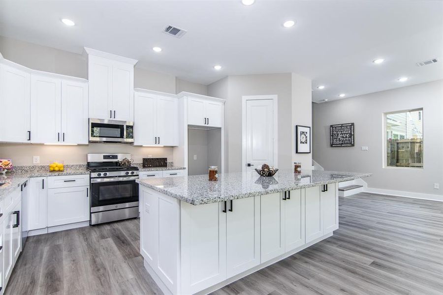 Kitchen has granite, and undercabinet lighting.