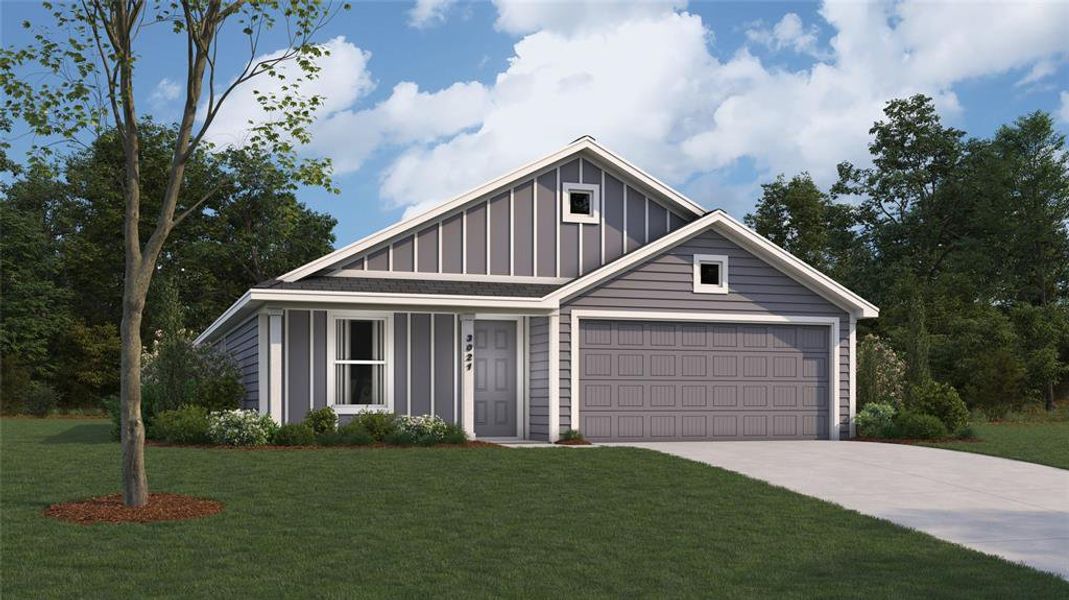 View of front facade featuring a garage and a front lawn