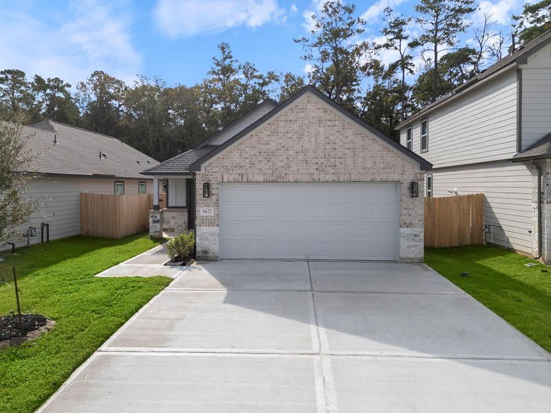 Front exterior of a new home in Cypresswood Landing, Humble, TX, highlighting curb appeal (Image 13).