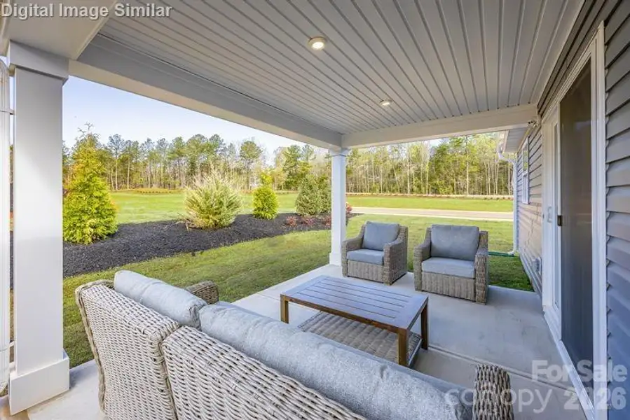Chill out under the rear covered porch — perfect for morning coffee, evening chats, and everything in between! Chill out under the rear covered porch — perfect for morning coffee, evening chats, and everything in between!