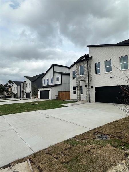 Front exterior of a new home in , Dallas, TX, highlighting curb appeal (Image 18).