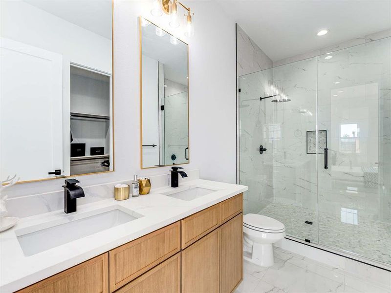 Double vanities with spacious wet area offering stand alone tub.  (this may vary per unit)