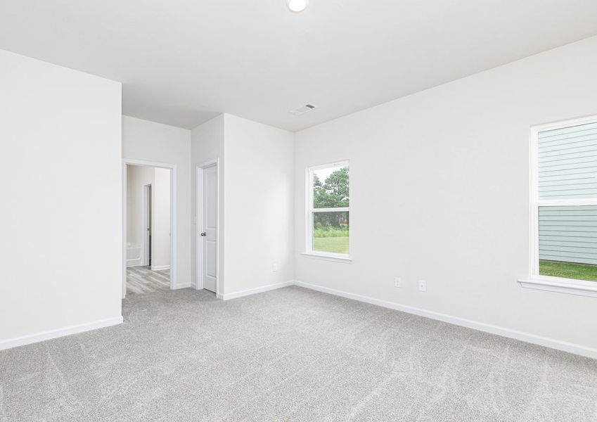 Rest and relaxation await in the master bedroom