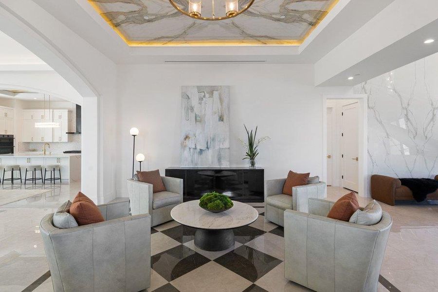 Marble accents and an open floorplan create a sophisticated and inviting living space.