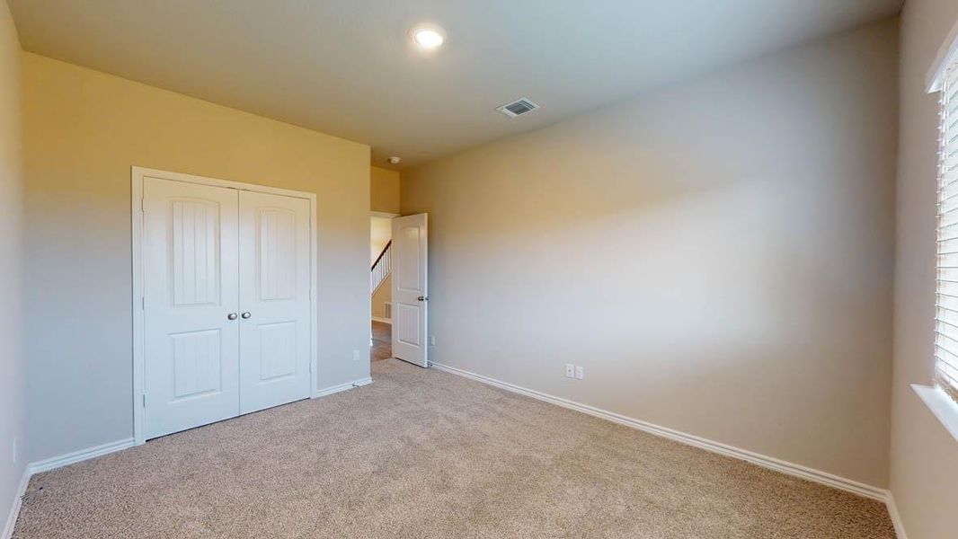 Unfurnished bedroom featuring carpet flooring, a closet, and recessed lighting Unfurnished bedroom featuring carpet flooring, a closet, and recessed lighting