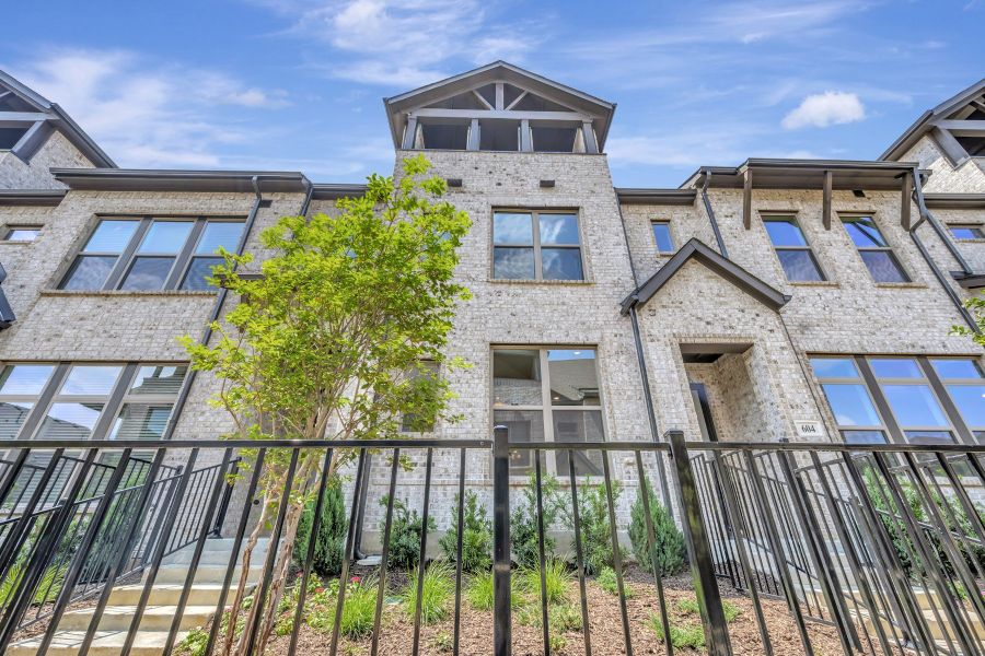 Front exterior of a new home in Hillside at Las Colinas, Irving, TX, highlighting curb appeal (Image 1). Front exterior of a new home in Hillside at Las Colinas, Irving, TX, highlighting curb appeal (Image 1).