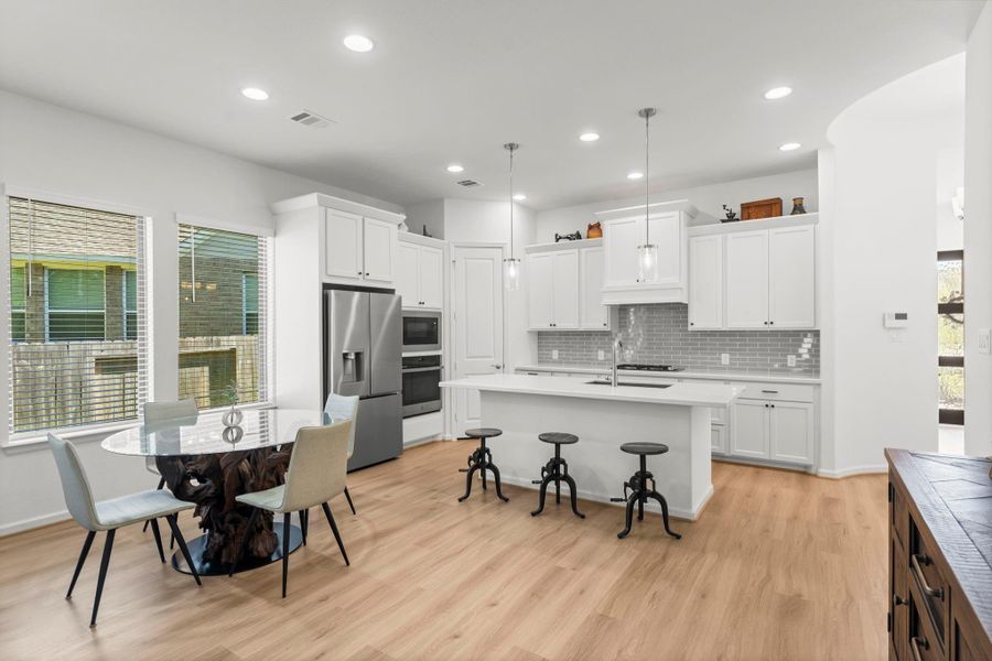 The dining area off the kitchen is spacious enough for a breakfast table or dining table and facilities a seamless flow from the kitchen to the living room.