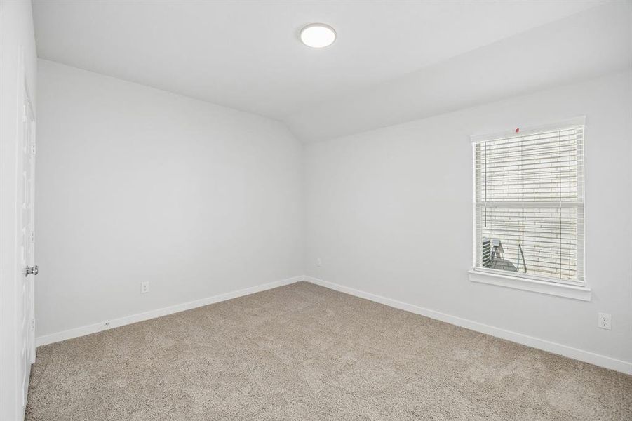 Bedroom in the Oscar home plan by Trophy Signature Homes – REPRESENTATIVE PHOTO