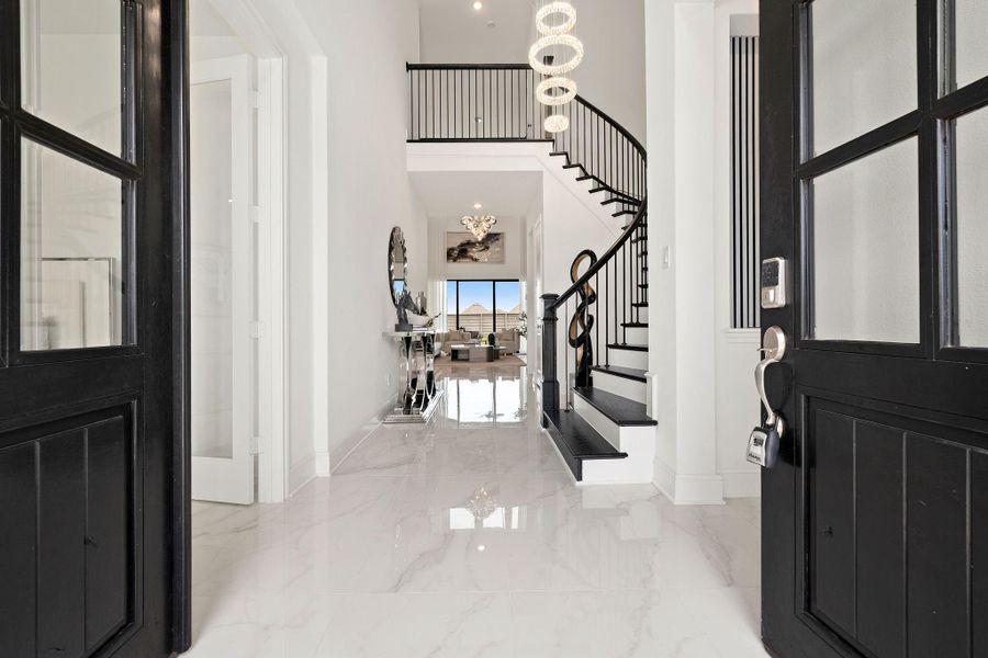 Impressive foyer with double doors, bright finishes, and an elegant first impression.