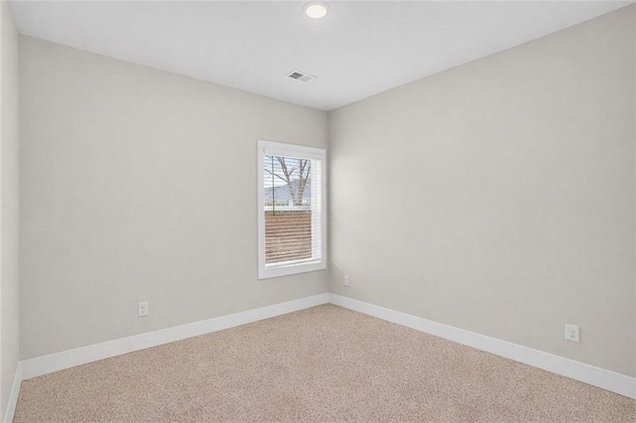 Spacious, unfurnished interior of a new home in The Fairways at Mirror Lake, Villa Rica (Image 26).