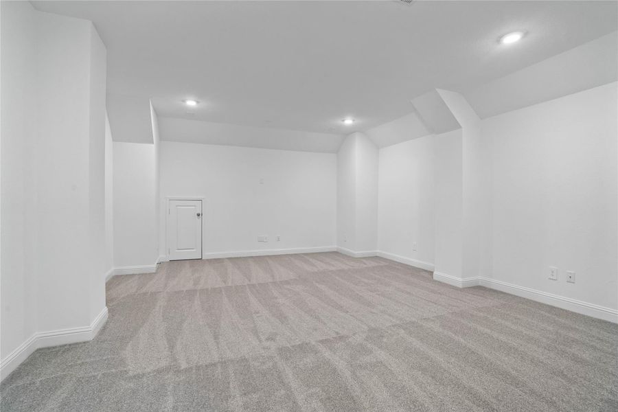 Grab the popcorn, put on a movie, and enjoy a wonderful evening in your amazing media room! Featuring plush carpet, custom paint, custom lighting makes this the perfect room for relaxing!