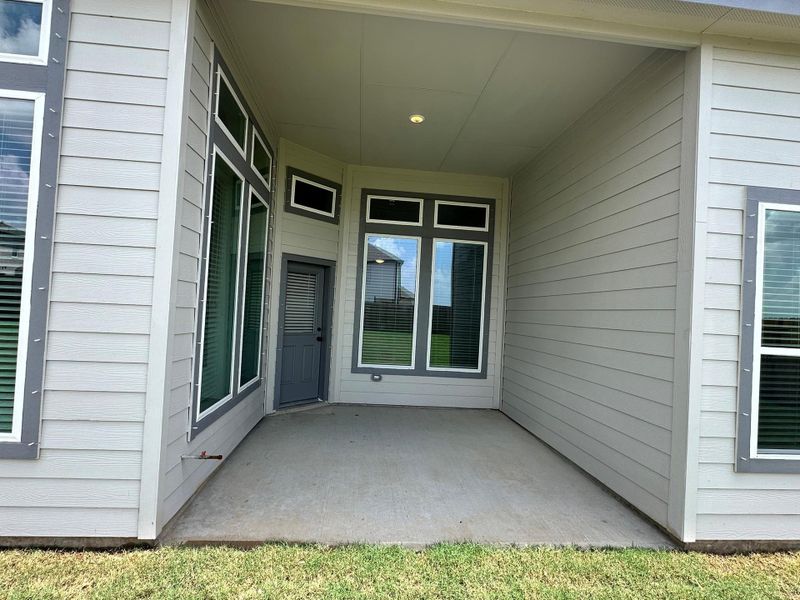 Exterior details and patio area of a home in Creekhaven, Iowa Colony (Image 3). Exterior details and patio area of a home in Creekhaven, Iowa Colony (Image 3).