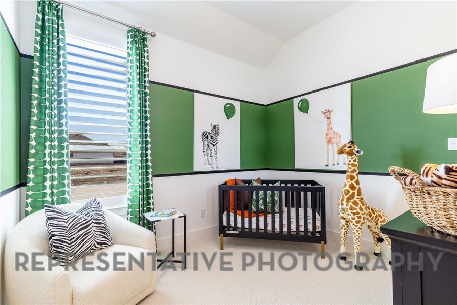 Carpeted bedroom with lofted ceiling Carpeted bedroom with lofted ceiling