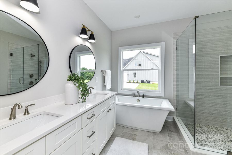 Primary Bath features dual, quartz vanity, soaking tub & large, all glass, frameless shower! Primary Bath features dual, quartz vanity, soaking tub & large, all glass, frameless shower!