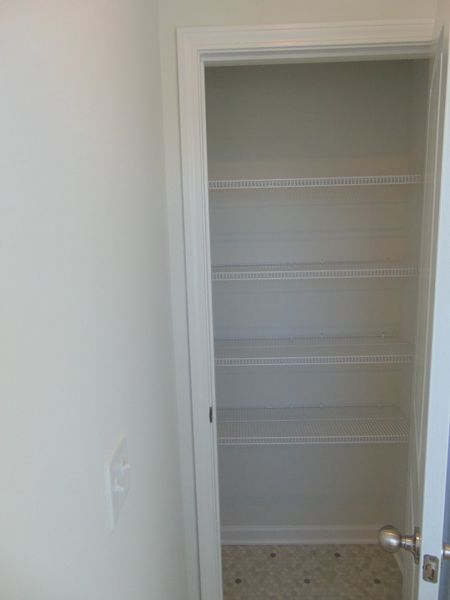 The linen closet within the primary bathroom