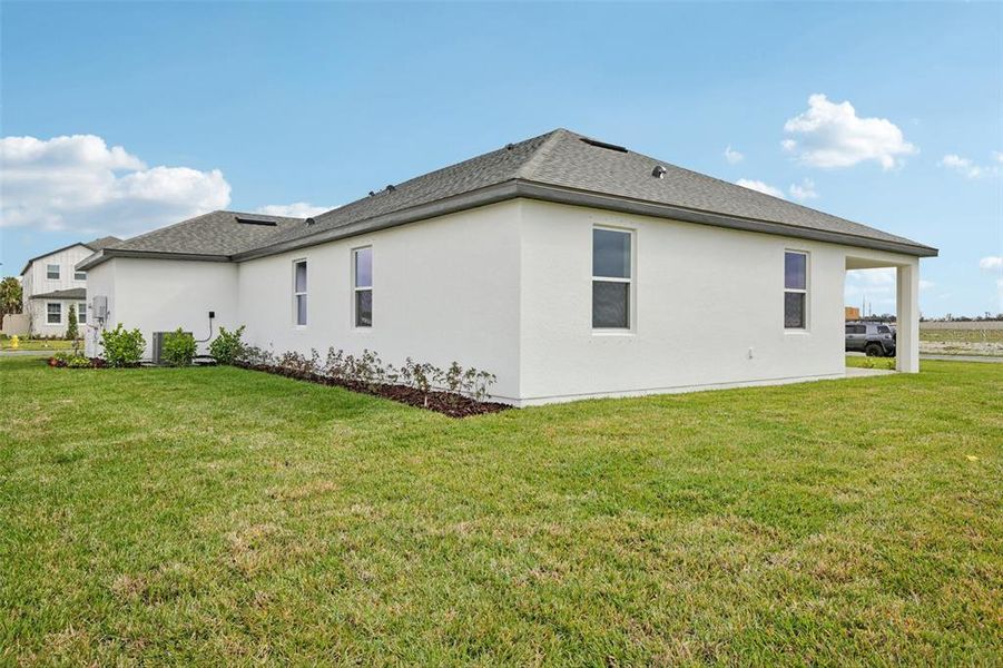 Exterior details and patio area of a home in Oakfield Trails, Parrish (Image 13).