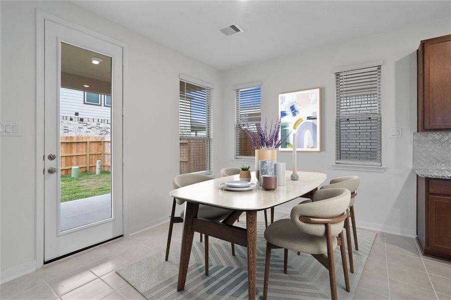 Start your day off right with a cup of coffee sitting with your family in the lovely breakfast area! Featuring large windows, custom paint, tile flooring and recessed lighting.