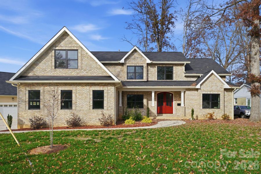 Stunning full front elevation with red double-door entry — a true modern classic. Stunning full front elevation with red double-door entry — a true modern classic.