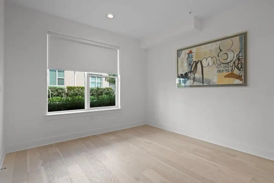 Smooth wood floors and tall windows define this versatile secondary space. Smooth wood floors and tall windows define this versatile secondary space.