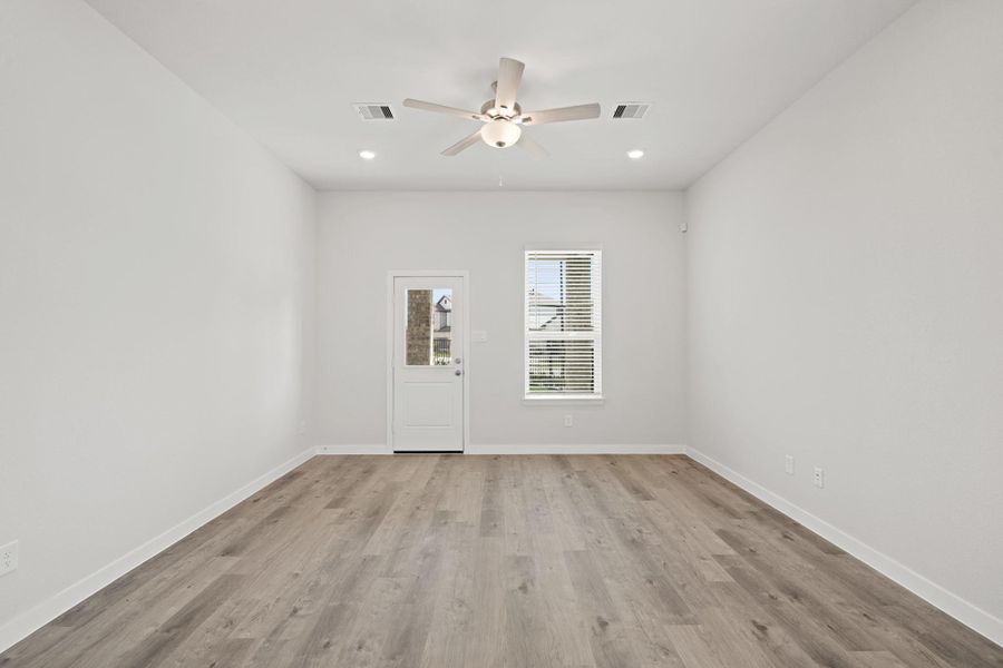 Spacious, unfurnished interior of a new home in Creekland Village at Bridgeland, Cypress (Image 19).